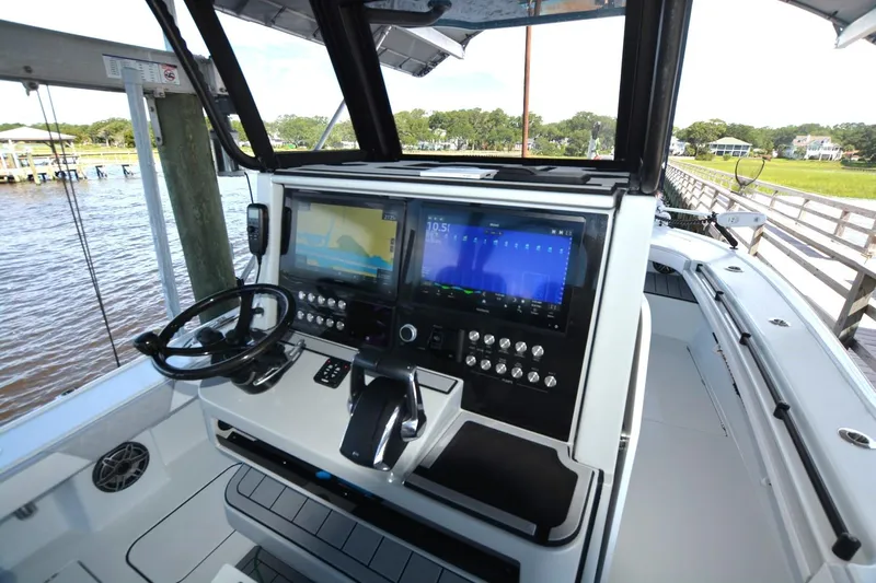 Carolina Bluewater Yacht Photos Pics 2024 Costa Custom Boats 264HC helm with advanced navigation displays and controls.