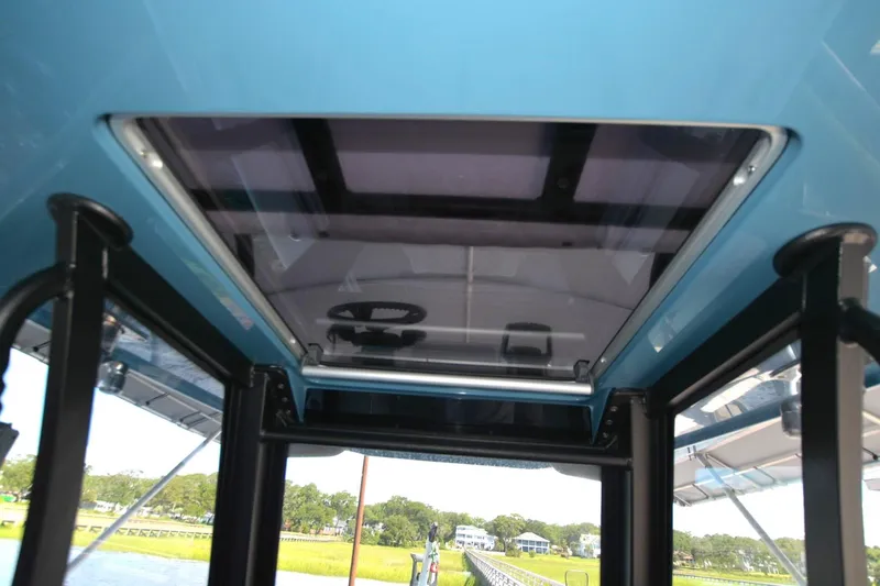 Carolina Bluewater Yacht Photos Pics 2024 Costa Custom Boats 264HC interior view with sunroof and steering wheel.