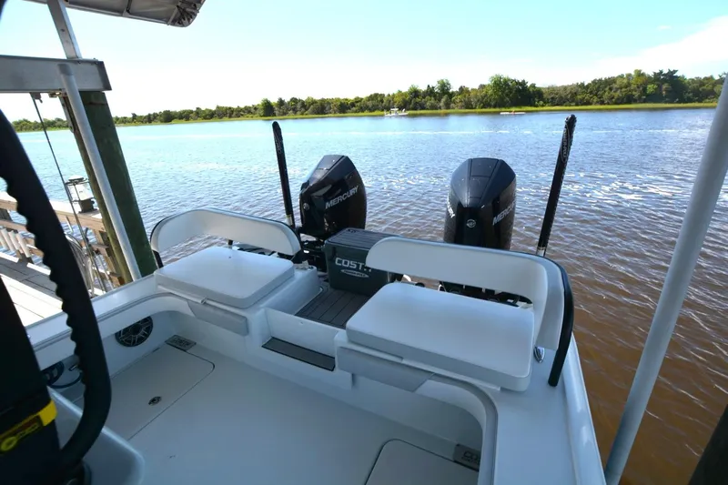 Carolina Bluewater Yacht Photos Pics 2024 Costa Custom Boats 264HC with dual Mercury engines on a serene river.