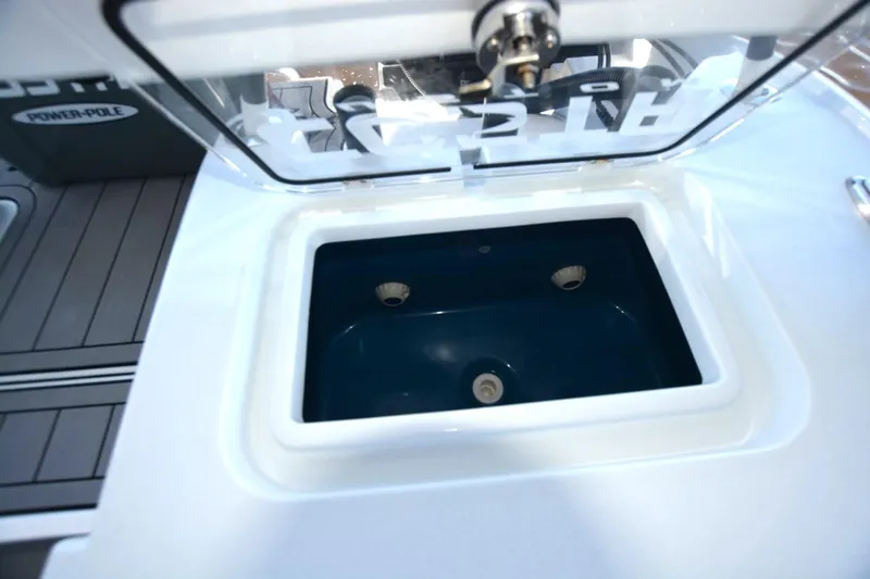 Carolina Bluewater Yacht Photos Pics Livewell compartment on 2024 Costa Custom Boats 264HC, featuring a sleek design and durable construction.