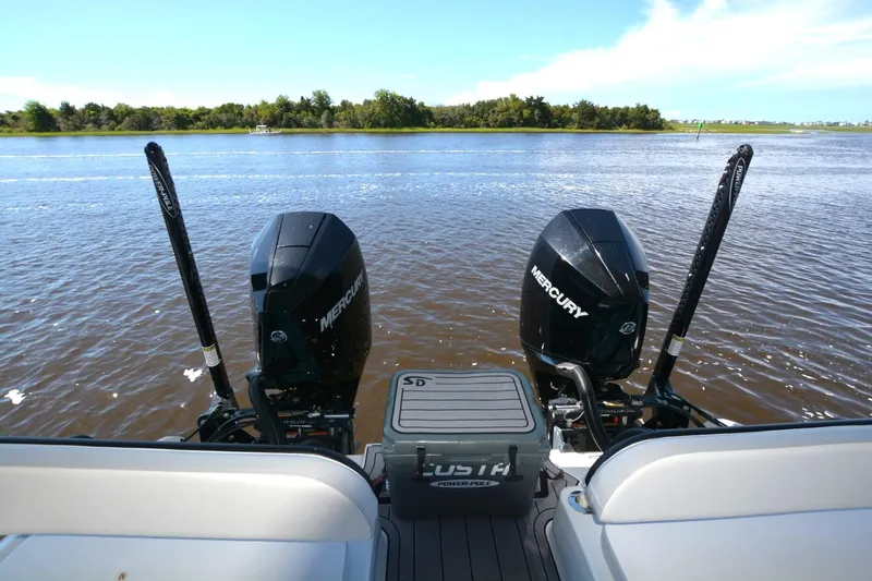 Carolina Bluewater Yacht Photos Pics 2024 Costa Custom Boats 264HC with dual Mercury engines on a serene lake.