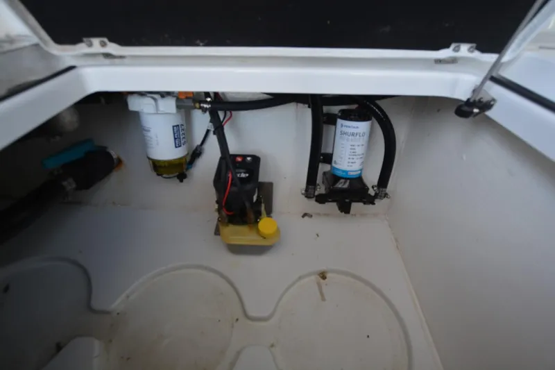 Carolina Bluewater Yacht Photos Pics 2024 Costa Custom Boats 264HC interior compartment with Shurflo pump and wiring.