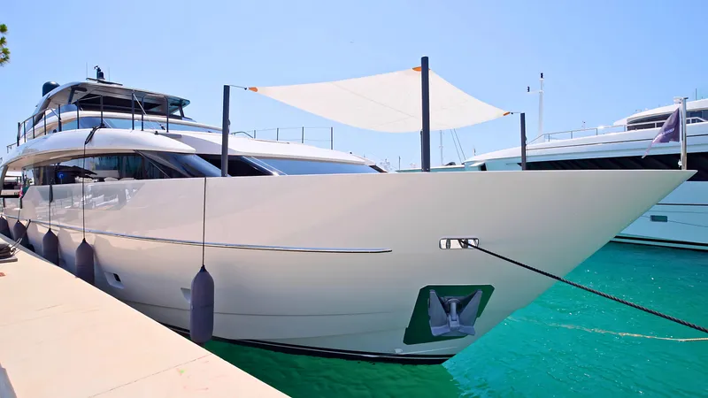 Eight44 Yacht Photos Pics Luxury Sanlorenzo SL90A yacht docked, 2025 model, in clear turquoise water.