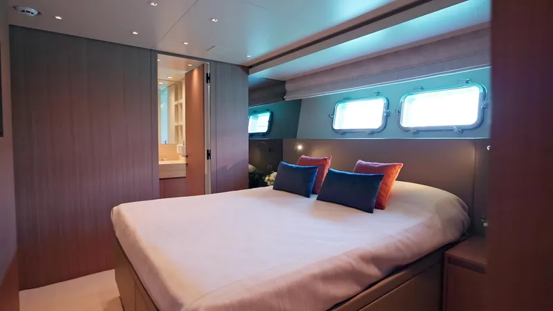 Eight44 Yacht Photos Pics Luxurious bedroom interior of 2025 Sanlorenzo SL90A yacht with modern design and ambient lighting.