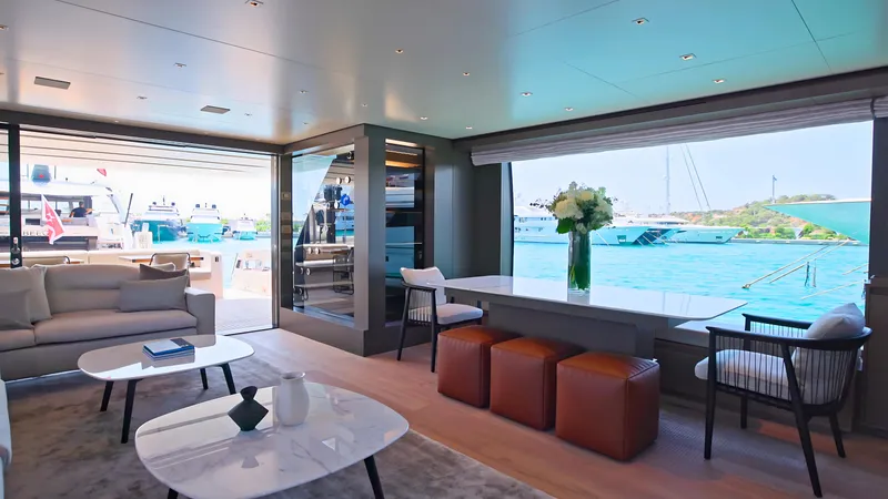 Eight44 Yacht Photos Pics Luxurious interior of 2025 Sanlorenzo SL90A yacht with ocean view and modern furnishings.