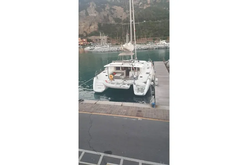 St Andrews Yacht Photos Pics 2014 Lagoon 450 F Owners Version catamaran docked at a marina.