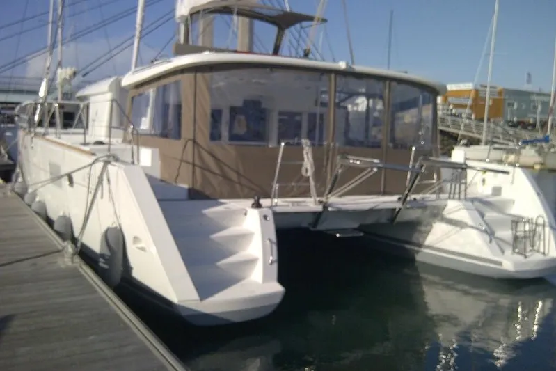 St Andrews Yacht Photos Pics 2014 Lagoon 450 F Owners Version catamaran docked at marina, rear view.