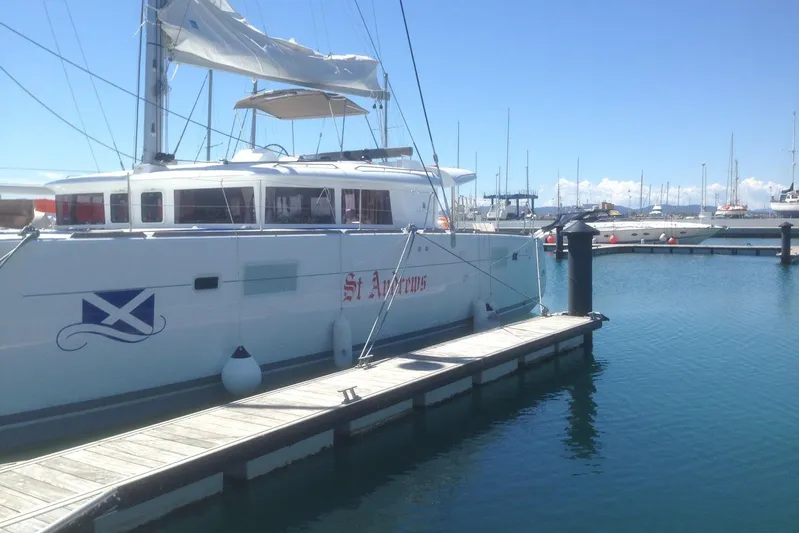 St Andrews Yacht Photos Pics 2014 Lagoon 450 F Owners Version catamaran docked at marina under clear blue sky.