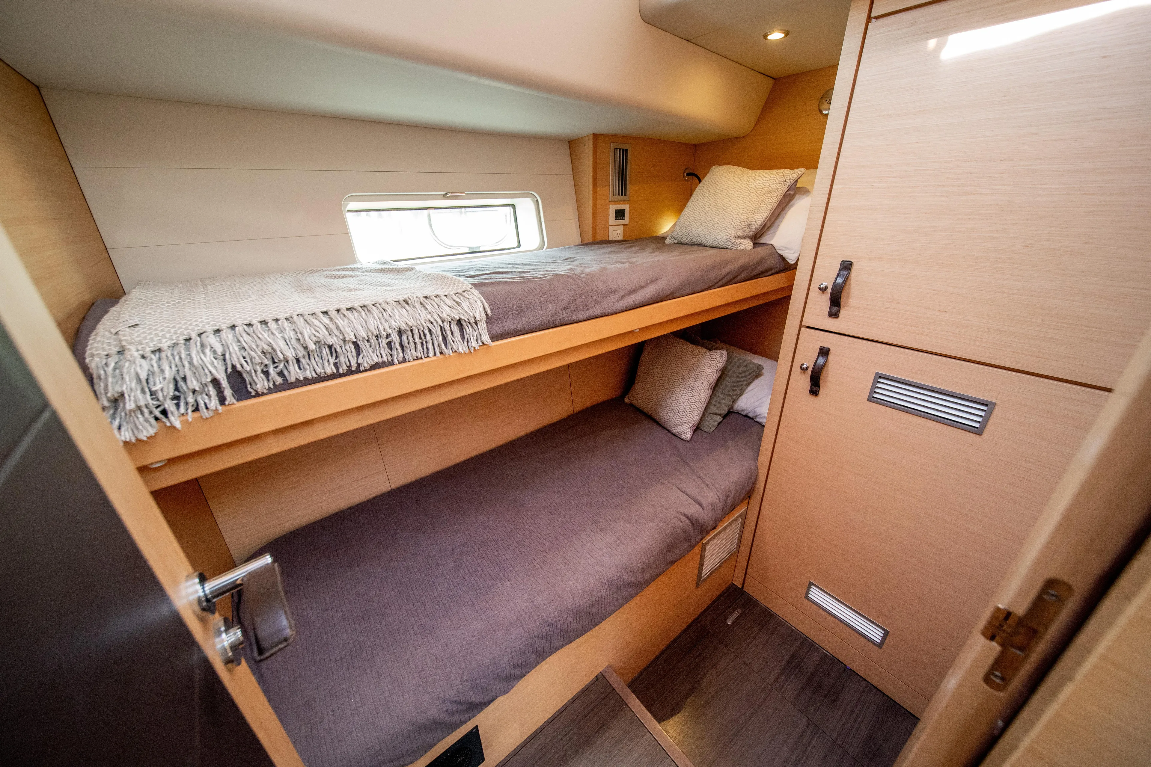 Serenity Yacht Photos Pics Compact cabin with bunk beds in 2016 Jeanneau 64 yacht.