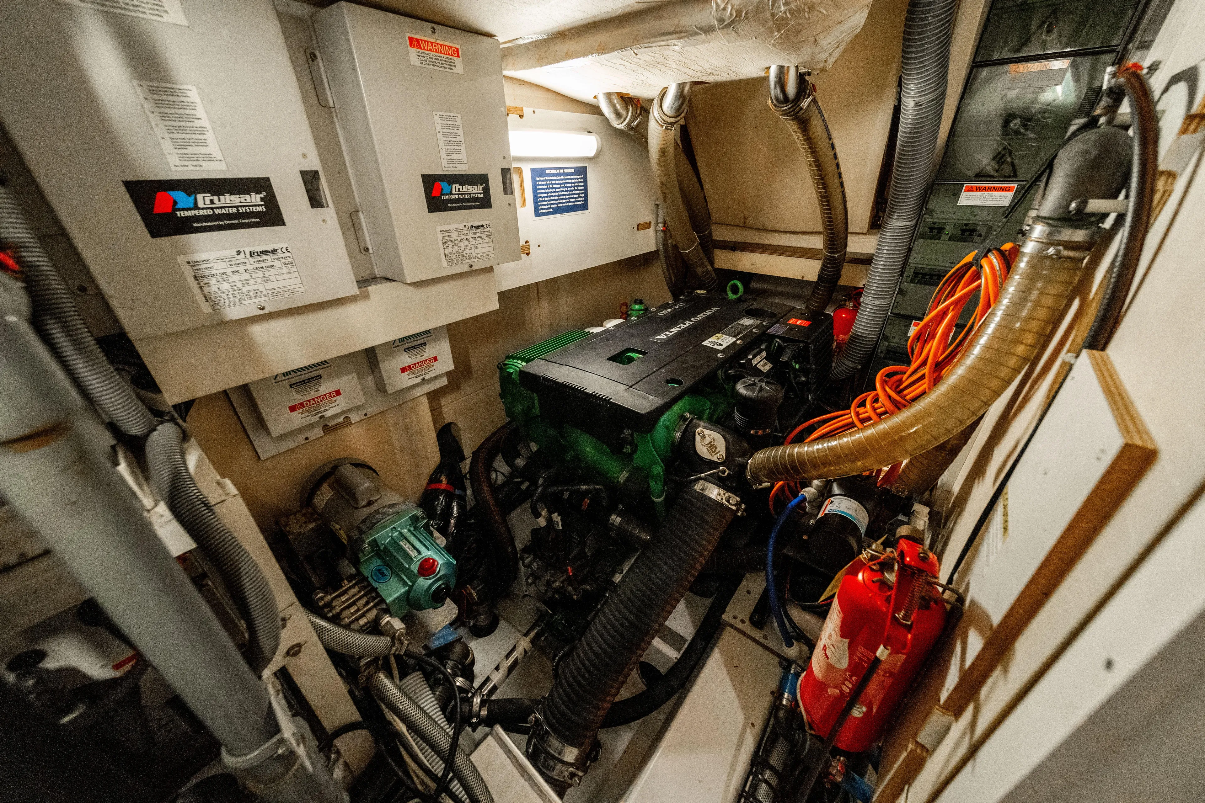Serenity Yacht Photos Pics Engine room of a 2016 Jeanneau 64 yacht, featuring mechanical and electrical systems.