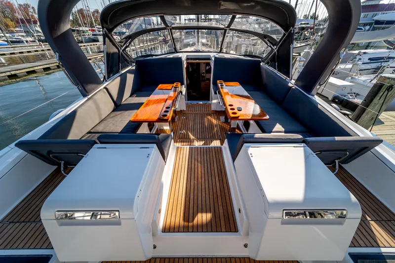 Serenity Yacht Photos Pics Luxurious 2016 Jeanneau 64 yacht cockpit with elegant seating and wooden tables.