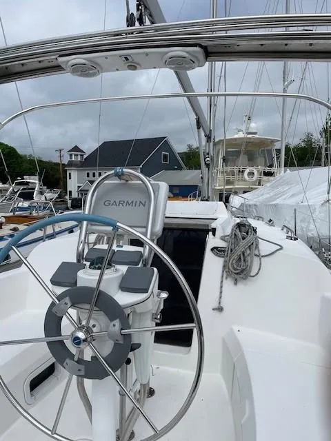 2004 Hunter 306 sailboat cockpit with Garmin navigation system, docked in a marina.