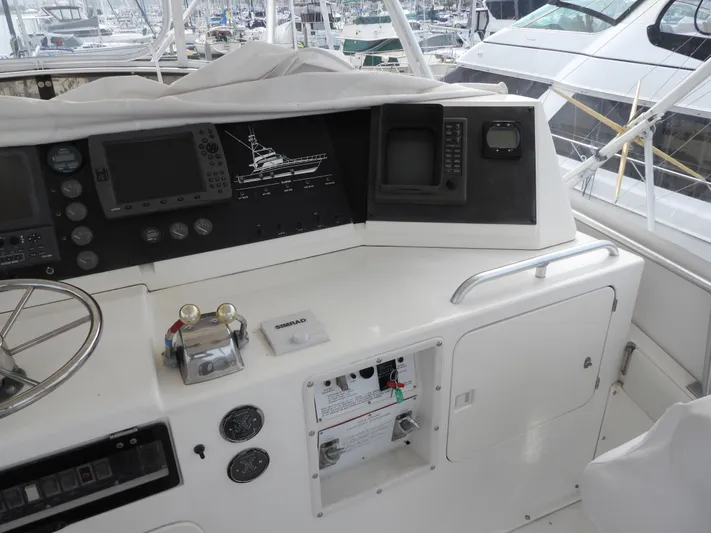  Yacht Photos Pics 1989 Bertram Convertible boat dashboard with navigation equipment and controls.