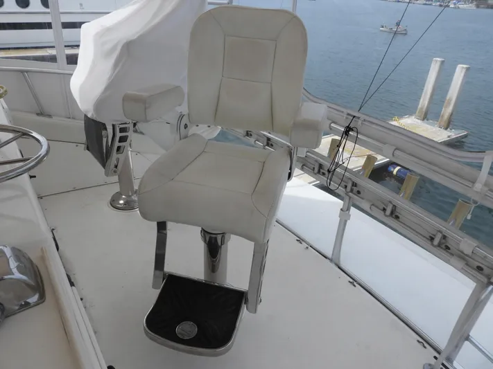  Yacht Photos Pics Captain's chair on 1989 Bertram Convertible yacht, overlooking marina.
