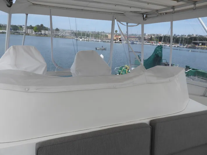  Yacht Photos Pics 1989 Bertram Convertible yacht interior with marina view in the background.