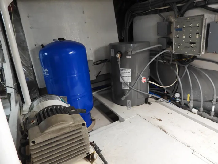  Yacht Photos Pics Engine room of a 1989 Bertram Convertible with machinery and equipment.