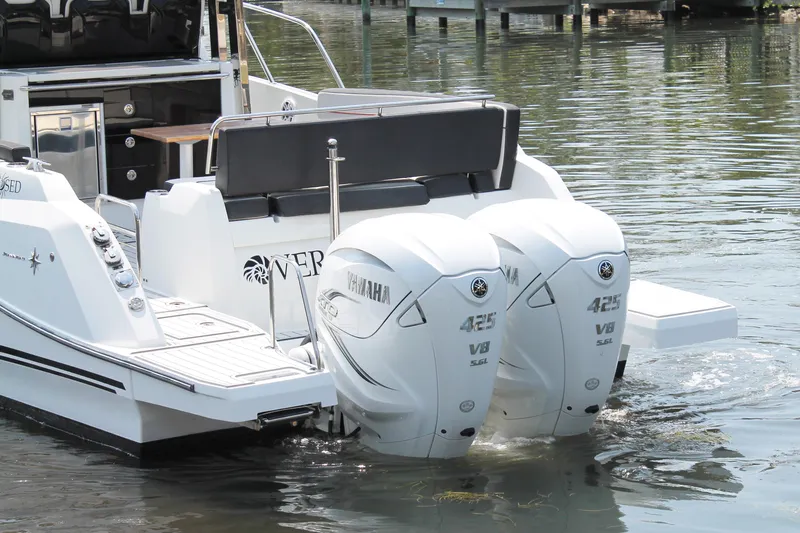 Over Exposed Yacht Photos Pics 2021 Jeanneau Leader 10.5 boat with twin Yamaha 425 V8 engines on water.