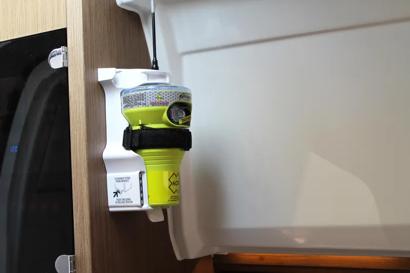 Over Exposed Yacht Photos Pics Emergency beacon mounted on 2021 Jeanneau Leader 10.5 boat interior.