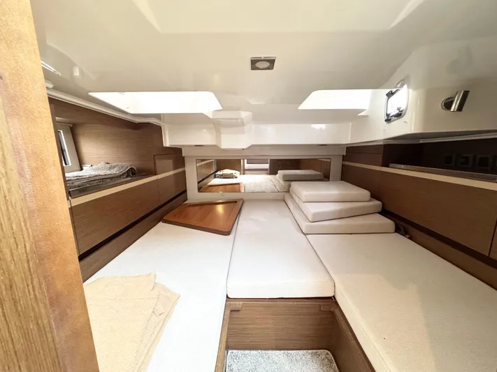 Over Exposed Yacht Photos Pics Interior of 2021 Jeanneau Leader 10.5 boat, featuring spacious seating and modern design.