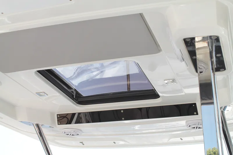 Over Exposed Yacht Photos Pics Ceiling view of 2021 Jeanneau Leader 10.5 boat with skylight and speakers.