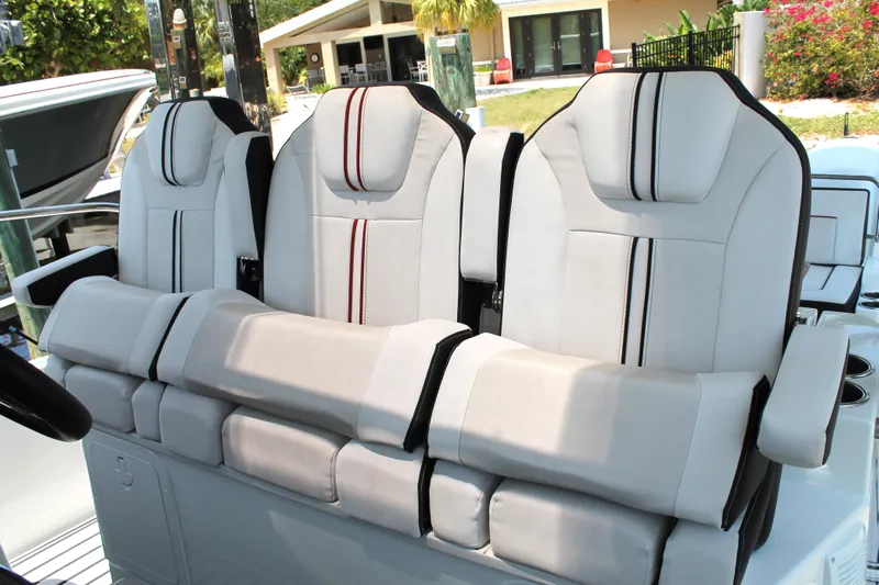 Over Exposed Yacht Photos Pics 2021 Jeanneau Leader 10.5 boat seats, featuring modern design and comfortable upholstery.