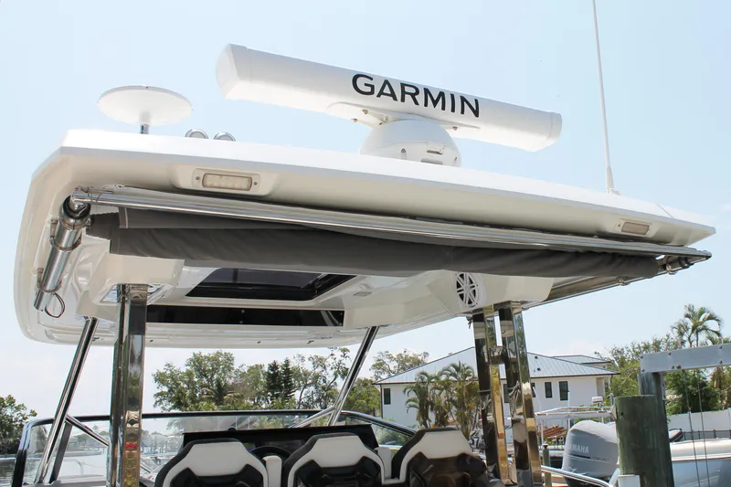 Over Exposed Yacht Photos Pics 2021 Jeanneau Leader 10.5 boat with Garmin radar, docked in a marina.