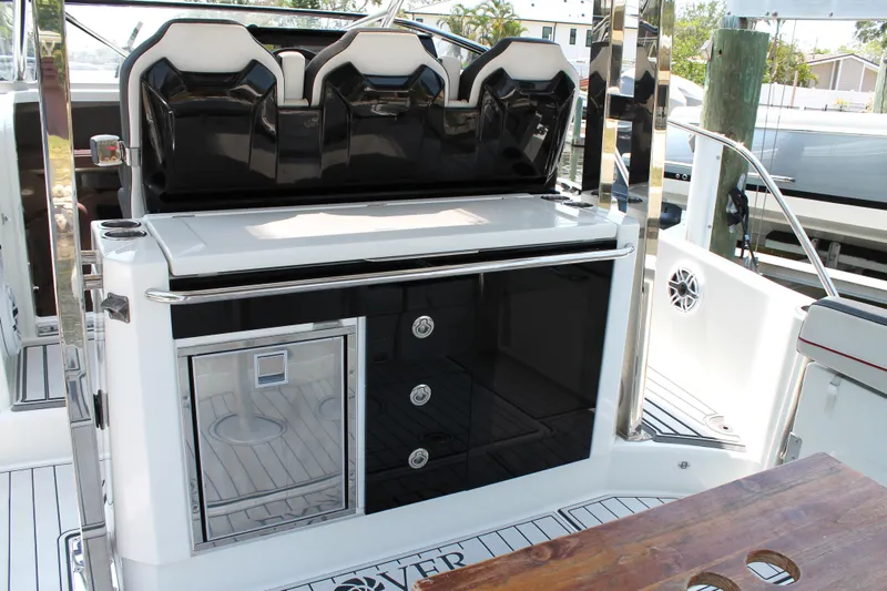 Over Exposed Yacht Photos Pics 2021 Jeanneau Leader 10.5 boat interior with seating and storage compartments.