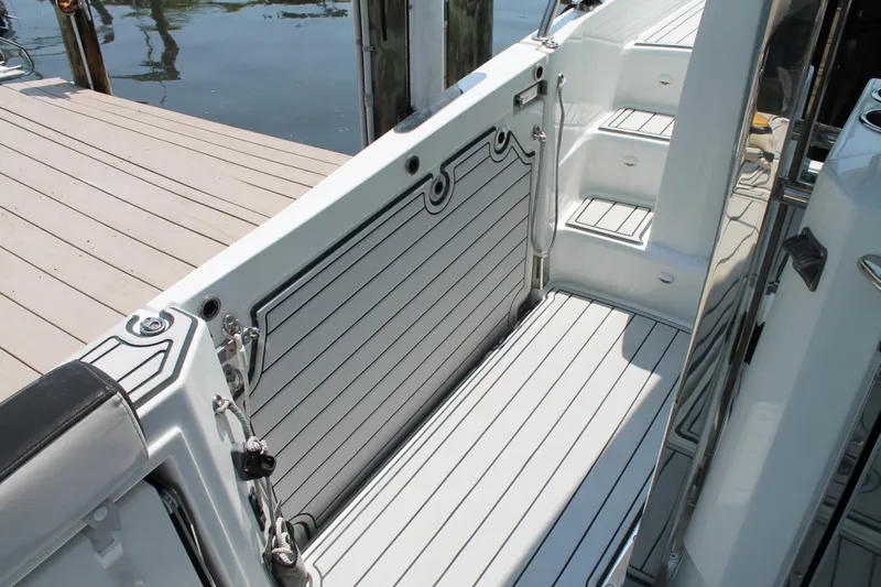 Over Exposed Yacht Photos Pics 2021 Jeanneau Leader 10.5 boat deck with sleek, modern design and dockside view.