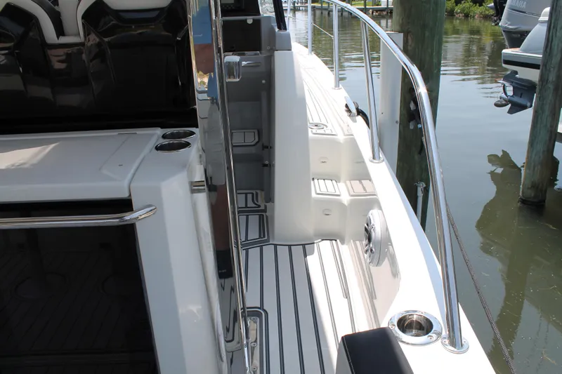 Over Exposed Yacht Photos Pics 2021 Jeanneau Leader 10.5 boat deck with sleek design and stainless steel railings.