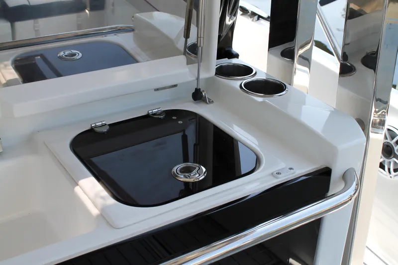 Over Exposed Yacht Photos Pics 2021 Jeanneau Leader 10.5 yacht kitchenette with sleek black and white design.