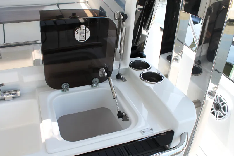Over Exposed Yacht Photos Pics 2021 Jeanneau Leader 10.5 boat sink area with cup holders and storage compartment.