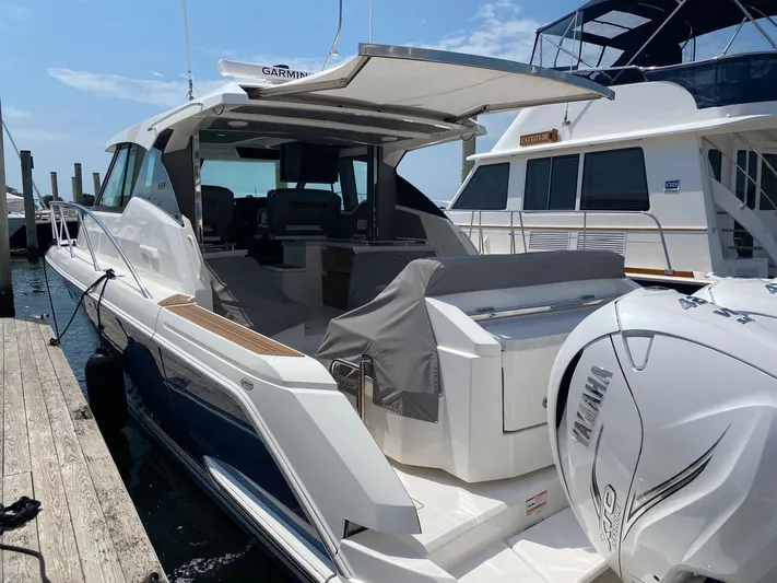  Yacht Photos Pics 2021 Tiara Yachts 43 LE docked, featuring Yamaha outboard engines and sleek design.
