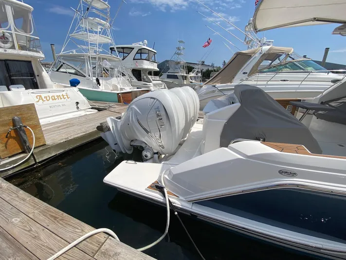  Yacht Photos Pics Tiara Yachts 2021 43 LE docked with Yamaha outboard engine, sunny marina setting.