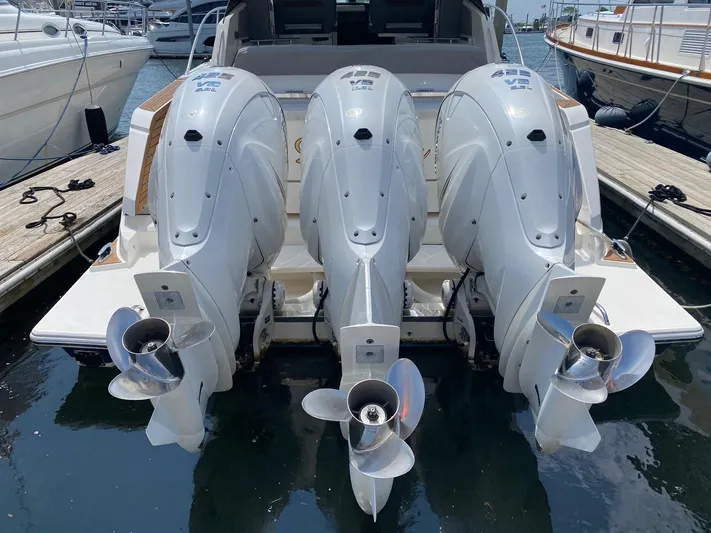  Yacht Photos Pics 2021 Tiara Yachts 43 LE with triple outboard engines at dock.