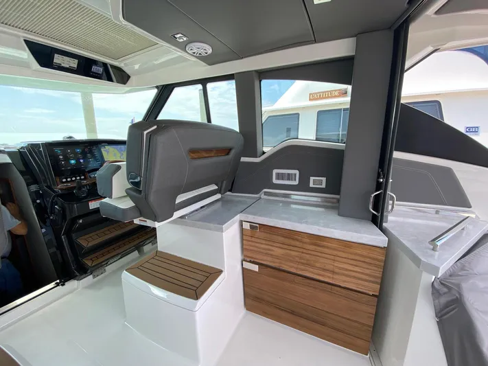  Yacht Photos Pics Interior of 2021 Tiara Yachts 43 LE, featuring modern helm and cabinetry.