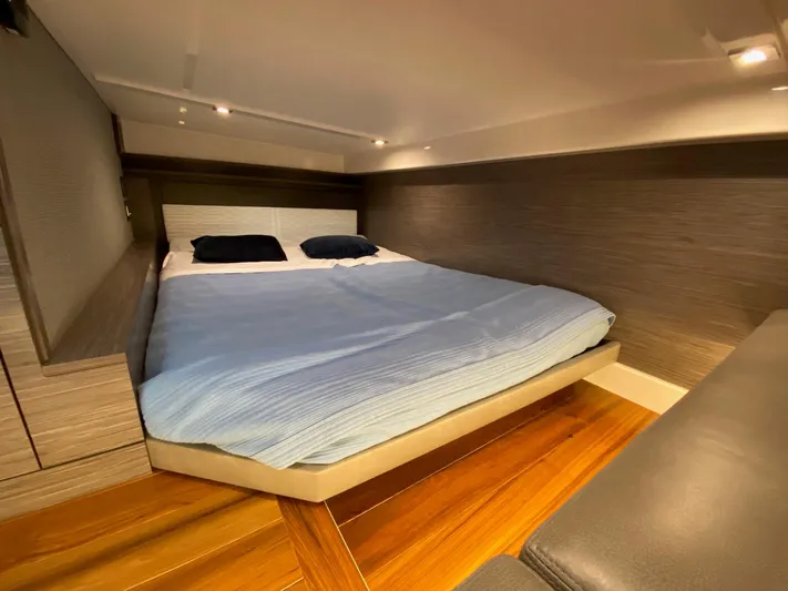  Yacht Photos Pics Luxurious cabin interior of 2021 Tiara Yachts 43 LE with cozy bed and modern design.