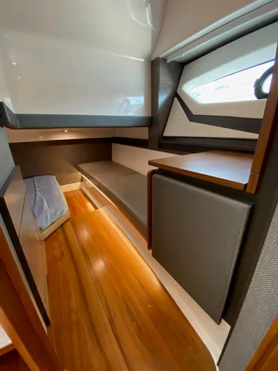 Yacht Photos Pics Interior cabin of 2021 Tiara Yachts 43 LE with wooden flooring and modern design.