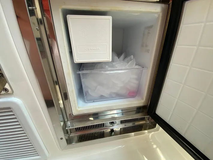  Yacht Photos Pics Ice maker on 2021 Tiara Yachts 43 LE, filled with ice cubes.