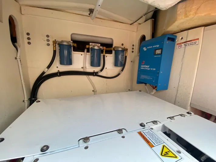  Yacht Photos Pics Engine compartment of 2021 Tiara Yachts 43 LE with battery charger and filters.