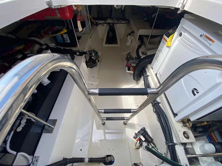  Yacht Photos Pics Engine room of 2021 Tiara Yachts 43 LE with ladder and equipment.