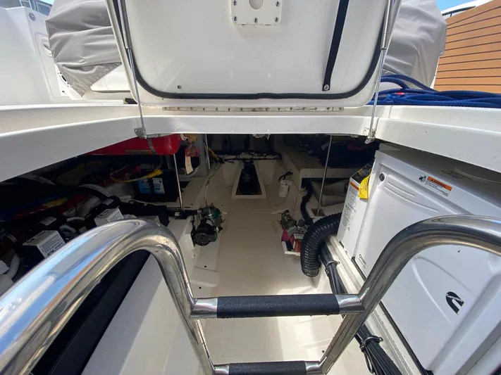  Yacht Photos Pics Engine compartment of 2021 Tiara Yachts 43 LE, showcasing equipment and storage.