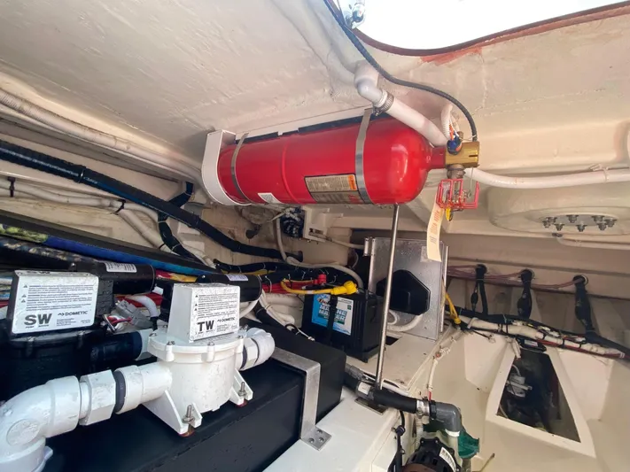  Yacht Photos Pics Engine room of 2021 Tiara Yachts 43 LE with fire extinguisher and equipment.