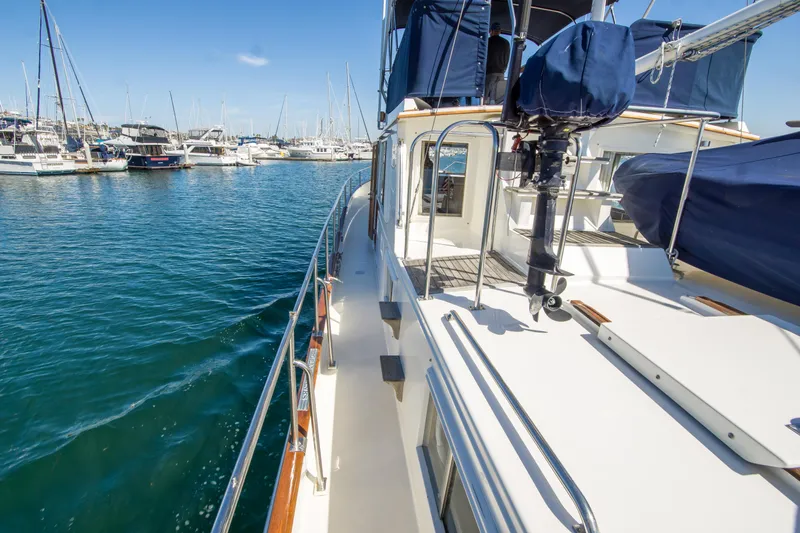 Dauntless Yacht Photos Pics 1995 Grand Banks 42 Classic yacht docked in a marina, showcasing sleek deck design.