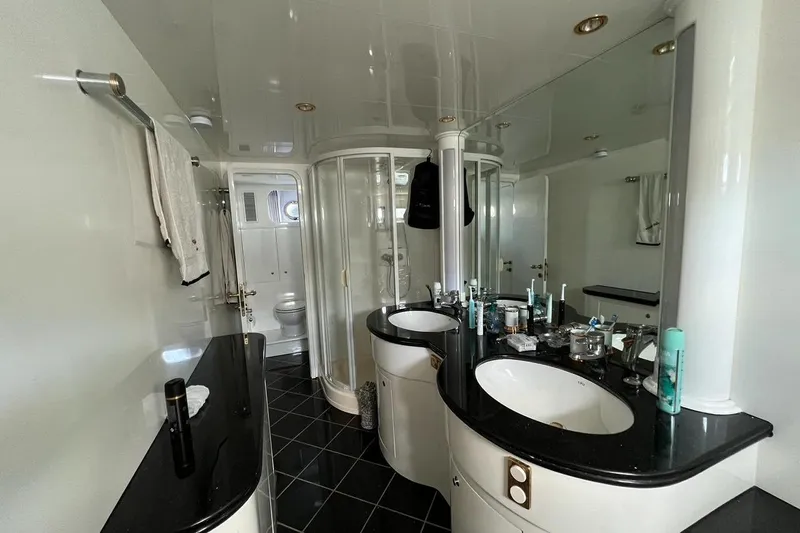  Yacht Photos Pics Luxurious bathroom in 2001 Horizon Elegance 82S yacht with dual sinks and modern fixtures.