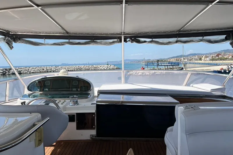  Yacht Photos Pics Cockpit view of 2001 Horizon Elegance 82S yacht overlooking marina and coastline.