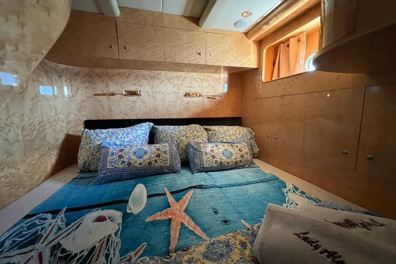  Yacht Photos Pics Luxurious cabin interior of 2001 Horizon Elegance 82S yacht with elegant bedding.