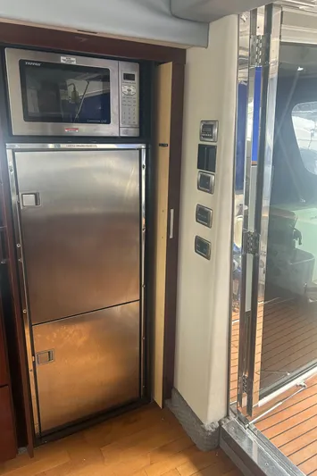  Yacht Photos Pics 2008 Sea Ray 47 Sedan Bridge yacht kitchen with stainless steel appliances and microwave.