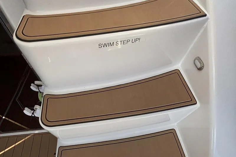  Yacht Photos Pics Steps on a 2008 Sea Ray 47 Sedan Bridge with "Swim Step Up!" text.