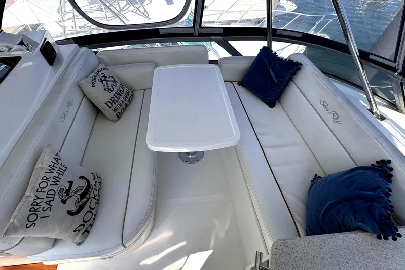  Yacht Photos Pics 2008 Sea Ray 47 Sedan Bridge interior with white seating and nautical-themed pillows.