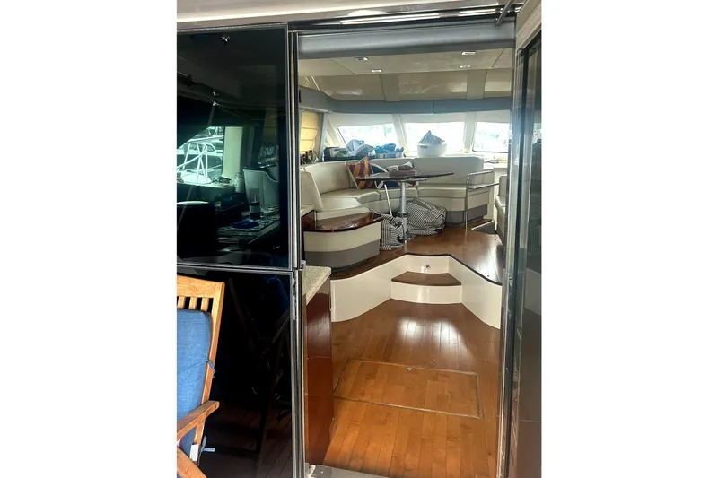  Yacht Photos Pics Interior view of 2008 Sea Ray 47 Sedan Bridge yacht with elegant seating and wooden flooring.